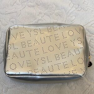Yves Saint Laurent Metallic Silver Pouch​​​